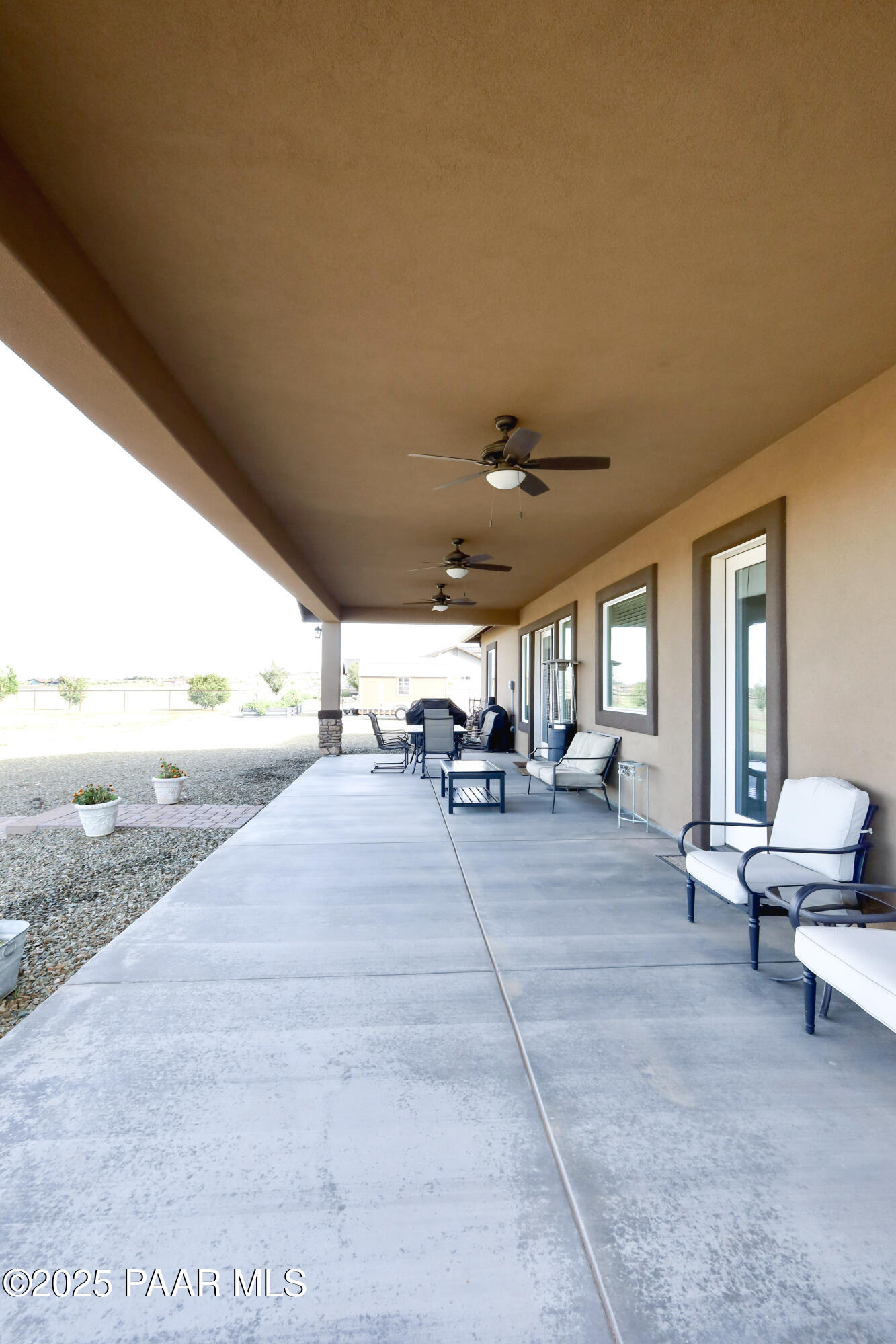 9860 North Loper Road Prescott Valley, AZ 86315 - Photo 44 of 53 a living room with furniture and a large window