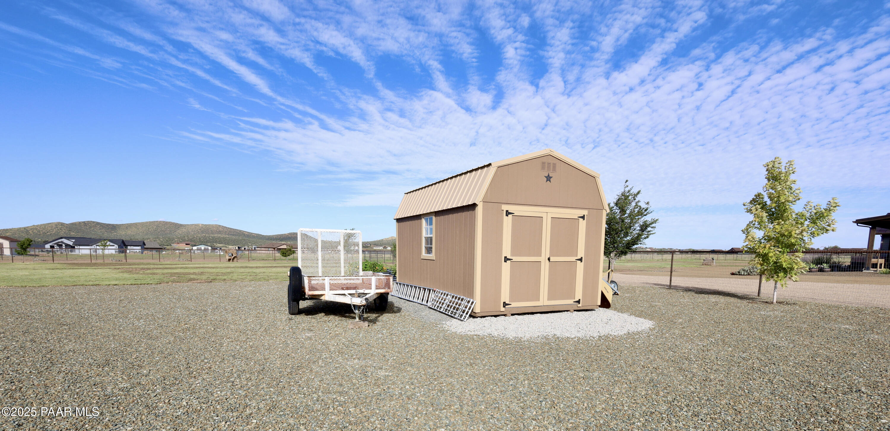 9860 North Loper Road Prescott Valley, AZ 86315 - Photo 49 of 53 a view of a house with a yard and a large window