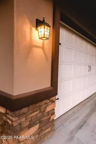 a kitchen with stainless steel appliances granite countertop a refrigerator stove top oven and cabinets