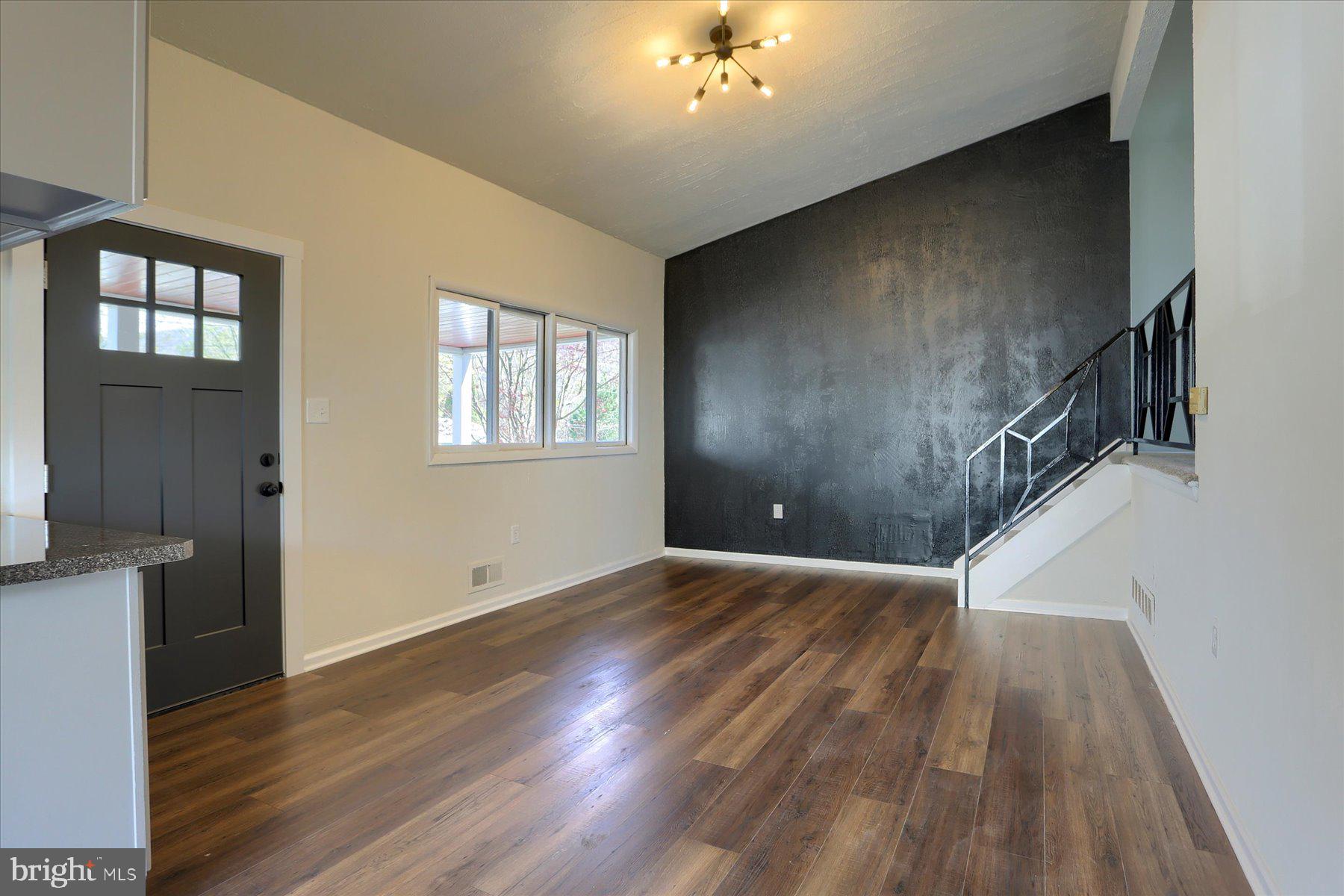 714 Edison Road Dauphin, PA 17018 - Photo 17 of 44 a view of an empty room with wooden floor and a window
