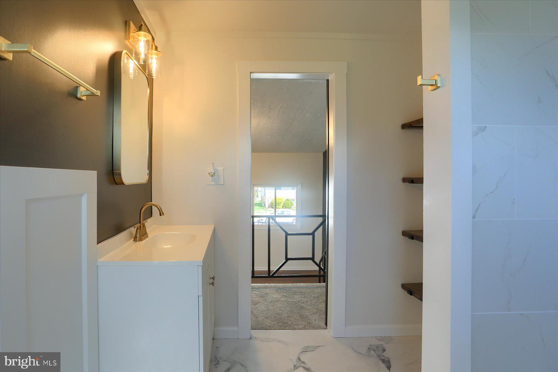 714 Edison Road Dauphin, PA 17018 - Photo 25 of 44 a en suite bathroom with a sink shower and a mirror