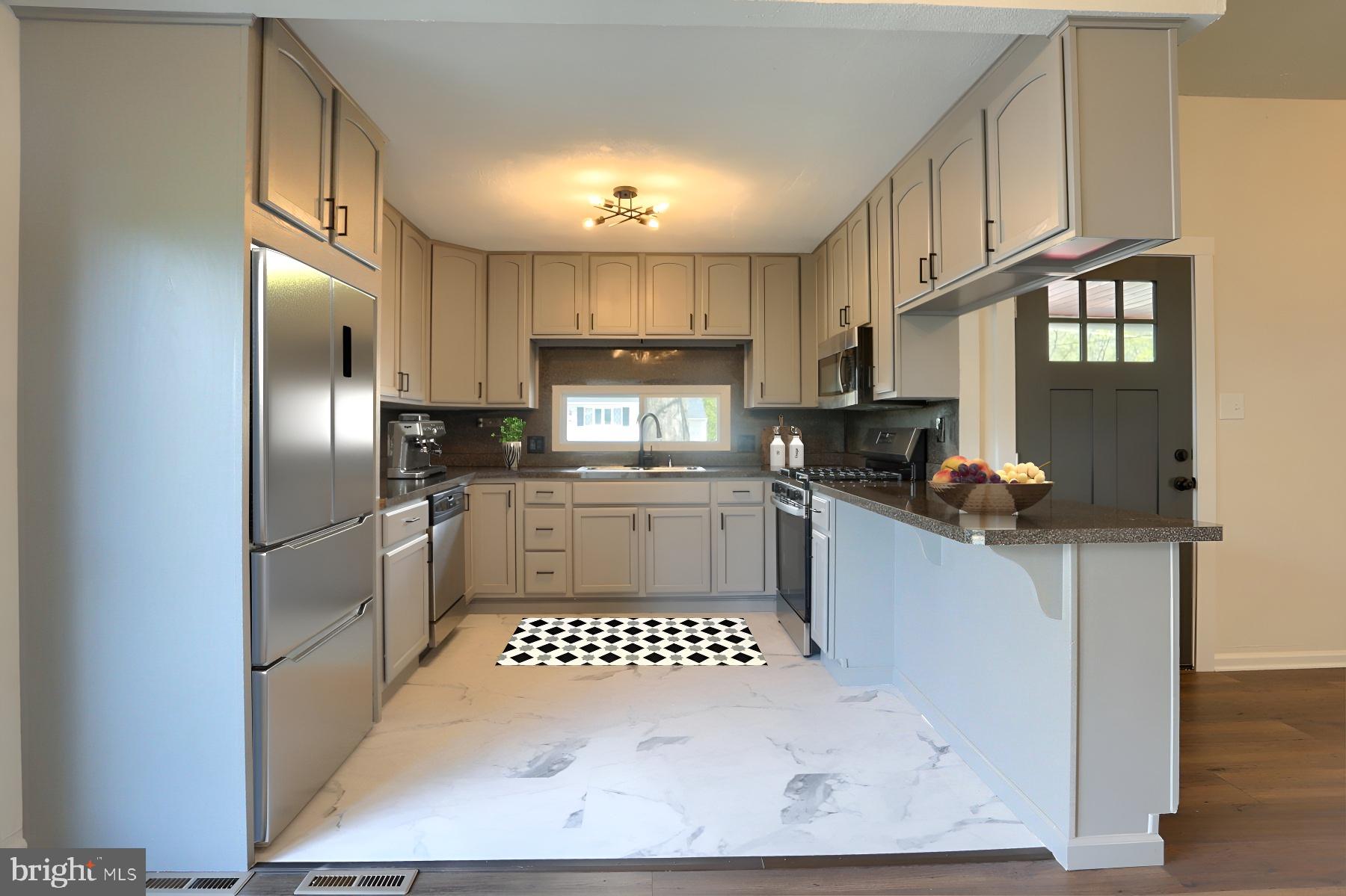 714 Edison Road Dauphin, PA 17018 - Photo 5 of 44 a kitchen with stainless steel appliances granite countertop a refrigerator a stove a sink and a microwave