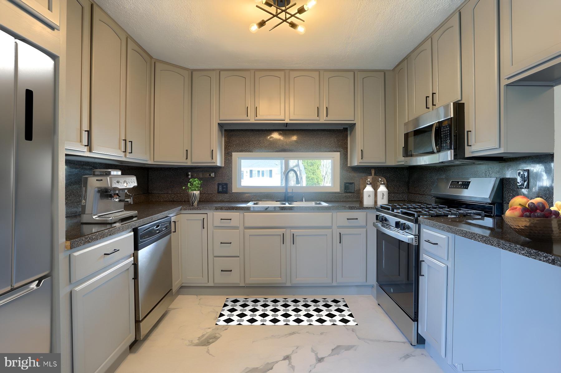 714 Edison Road Dauphin, PA 17018 - Photo 6 of 44 a kitchen with stainless steel appliances granite countertop a stove a sink and a microwave