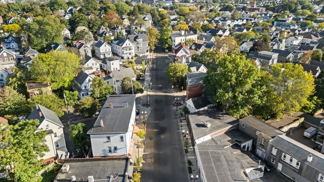 an aerial view of residential houses with outdoor space