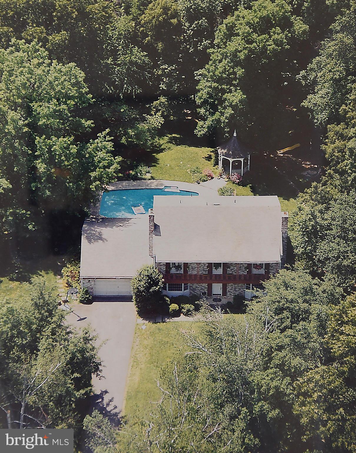 17939 Pond Road Ashton, MD 20861 - Photo 1 of 29 an aerial view of a house with yard swimming pool and outdoor seating
