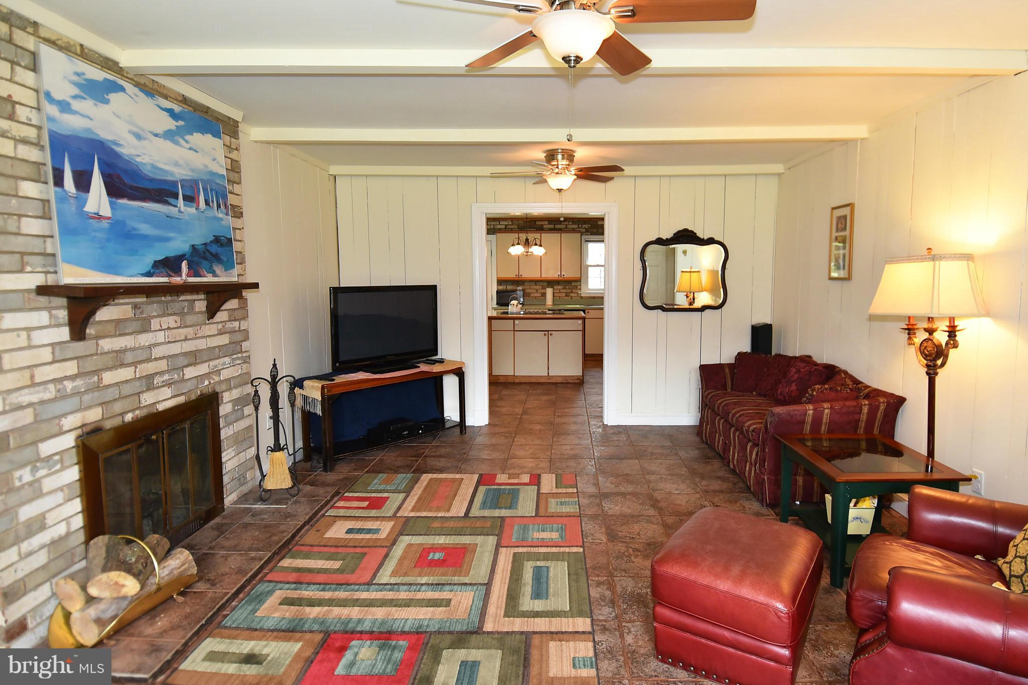 17939 Pond Road Ashton, MD 20861 - Photo 12 of 29 a living room with furniture and a flat screen tv