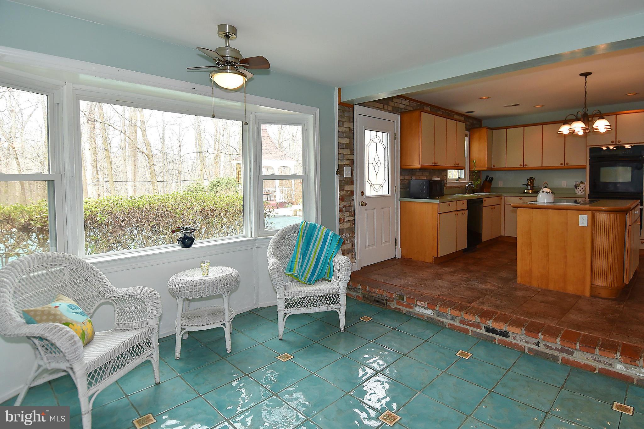 17939 Pond Road Ashton, MD 20861 - Photo 14 of 29 a living room with fireplace furniture and a large window
