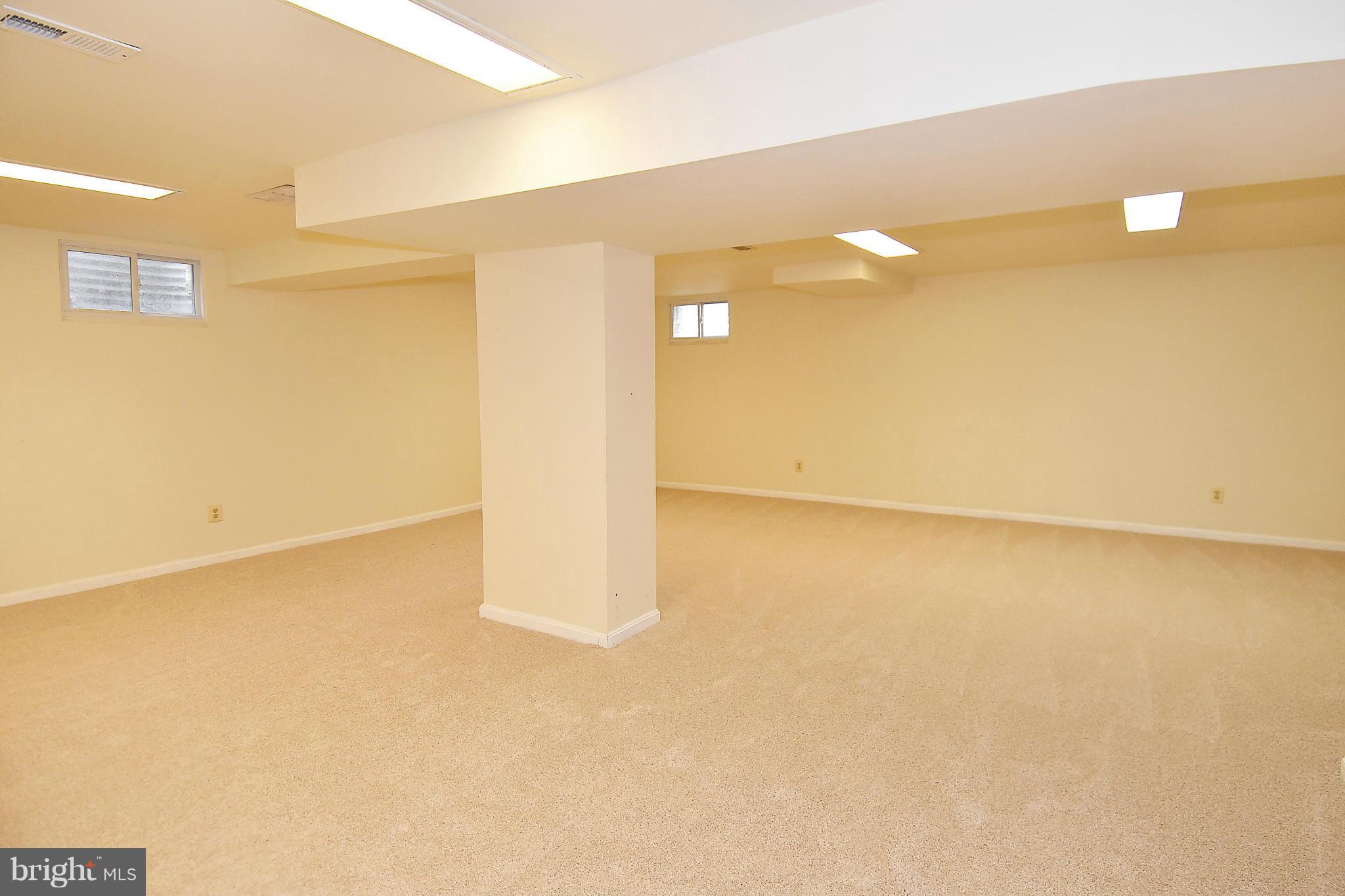 17939 Pond Road Ashton, MD 20861 - Photo 20 of 29 a view of a big room with windows