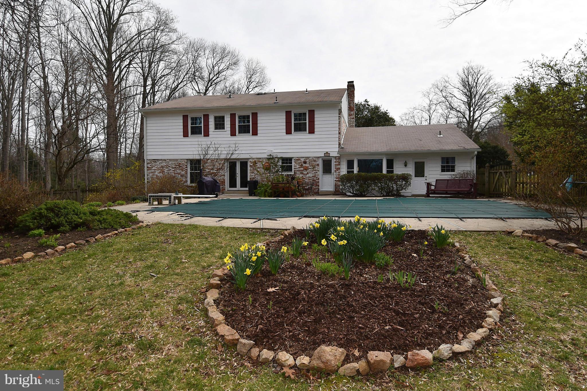 17939 Pond Road Ashton, MD 20861 - Photo 24 of 29 a front view of a house with garden
