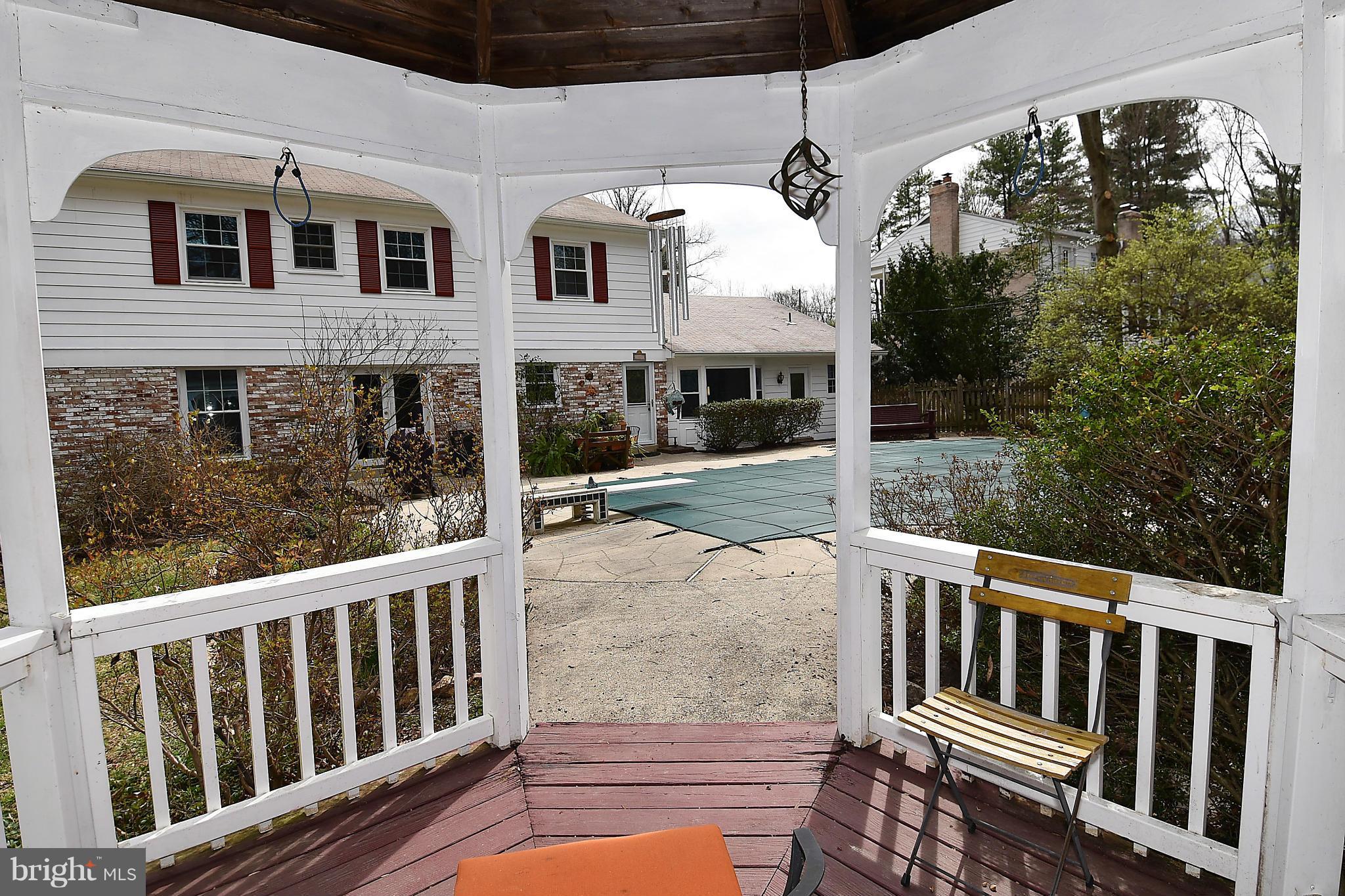 17939 Pond Road Ashton, MD 20861 - Photo 25 of 29 a view of a house with backyard porch and wooden floor