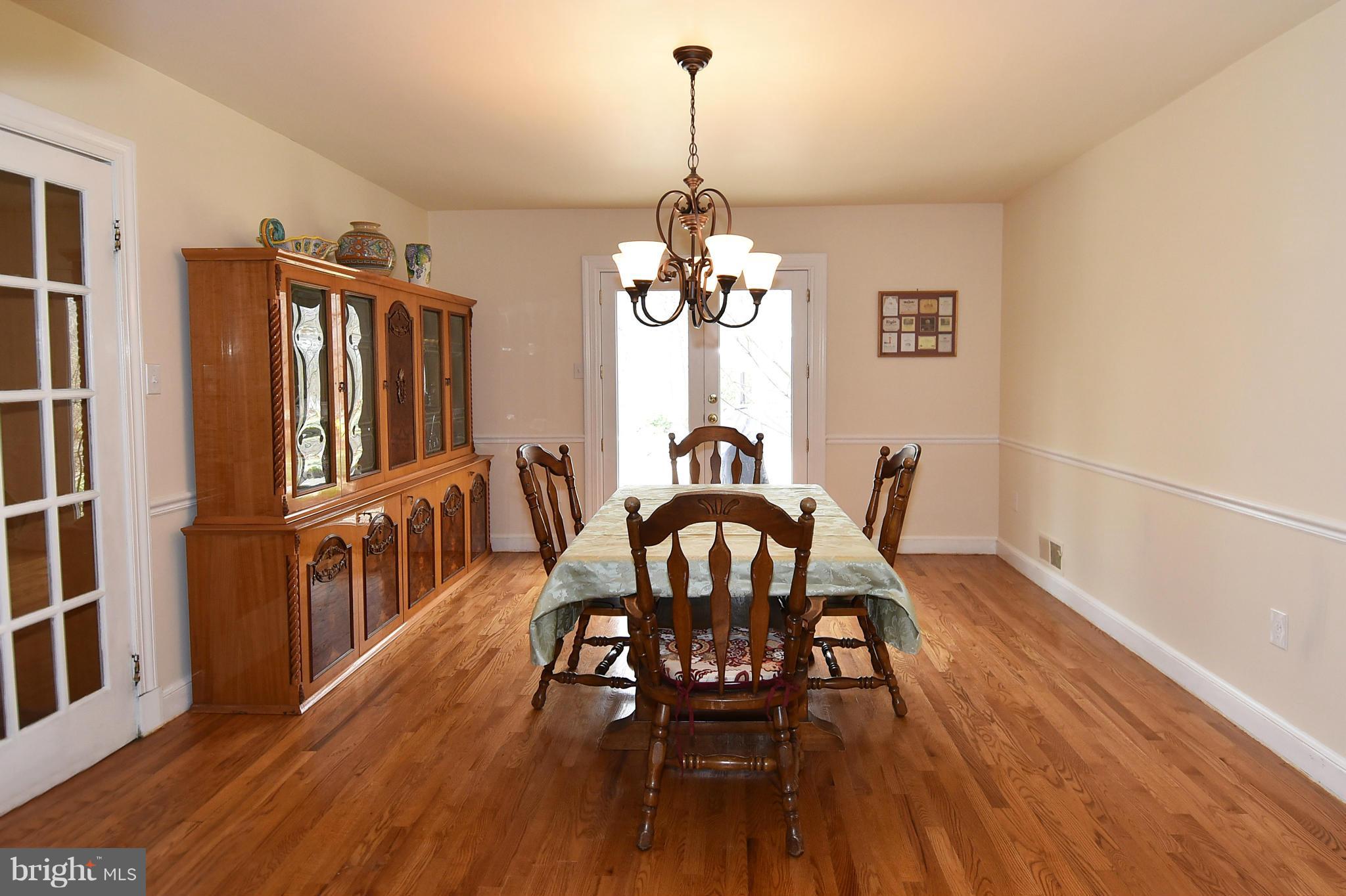 17939 Pond Road Ashton, MD 20861 - Photo 9 of 29 a dining room with furniture window and wooden floor