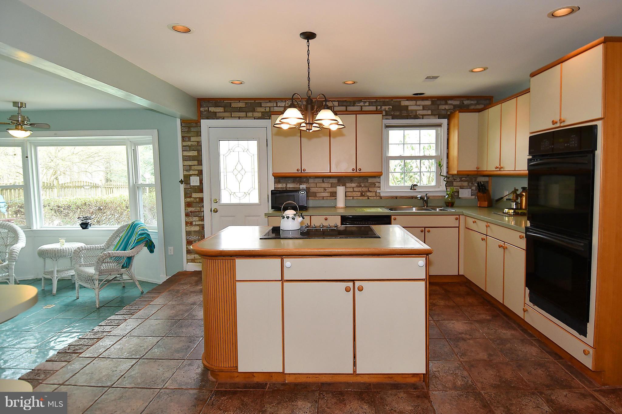 17939 Pond Road Ashton, MD 20861 - Photo 10 of 29 a kitchen with a sink stove and refrigerator