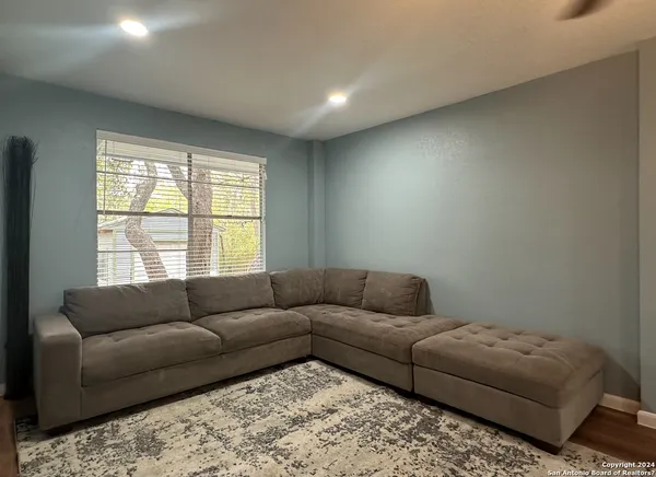 a living room with furniture and a window