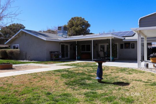 218 South Lilac Street Ridgecrest, CA 93555 - Photo 34 of 43 a view of a house with a yard and sitting area