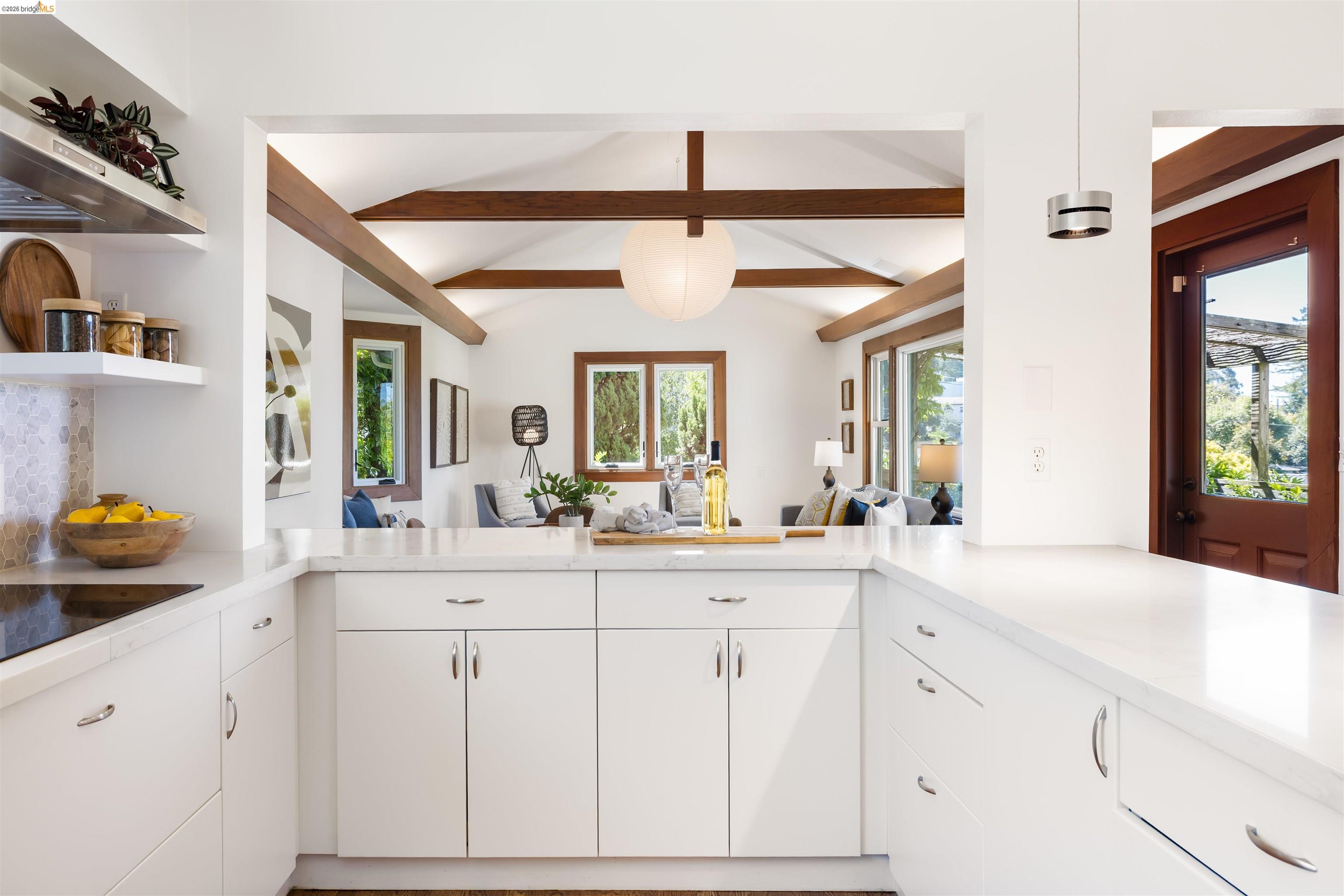 900 Euclid Avenue Berkeley, CA 94708 - Photo 14 of 54 a kitchen with a sink dishwasher and white cabinets with wooden floor