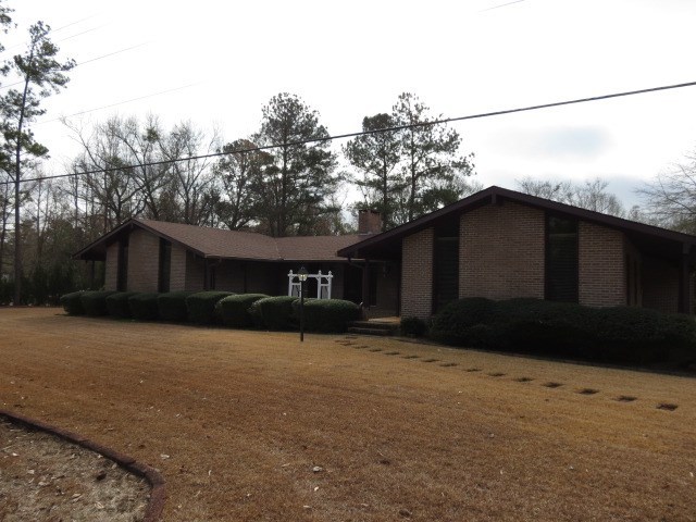 6974 Columbus Road Lizella, GA 31052 - Photo 1 of 19 a house view with a outdoor space