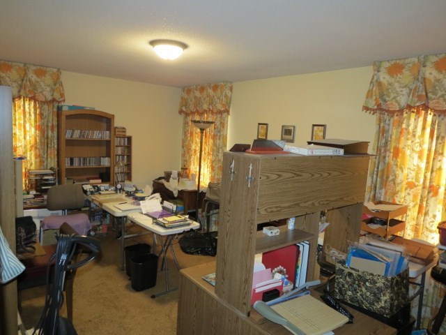 6974 Columbus Road Lizella, GA 31052 - Photo 13 of 19 a work room with furniture and window