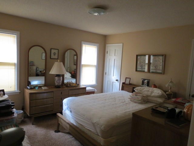 6974 Columbus Road Lizella, GA 31052 - Photo 14 of 19 a bedroom with a bed and a dresser