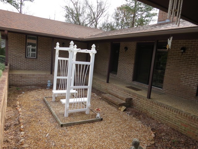 6974 Columbus Road Lizella, GA 31052 - Photo 15 of 19 a front view of a house with a porch