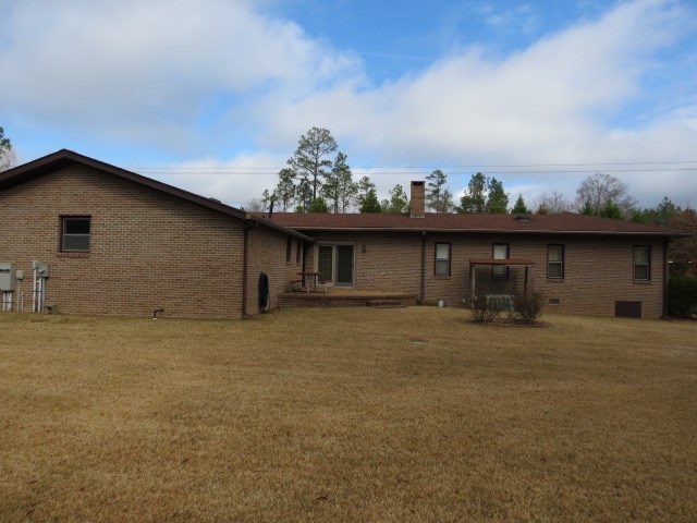 6974 Columbus Road Lizella, GA 31052 - Photo 19 of 19 a view of a house with a patio