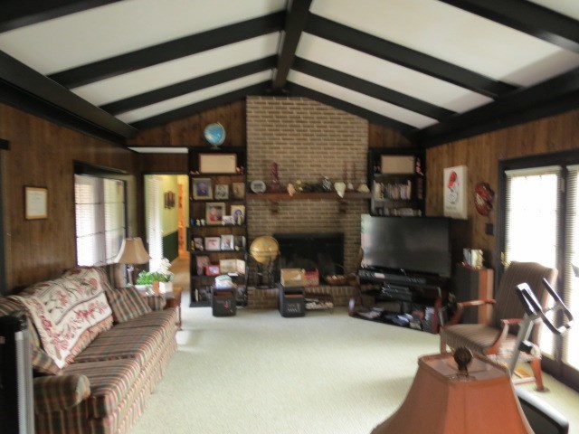 6974 Columbus Road Lizella, GA 31052 - Photo 6 of 19 a bedroom with furniture and a fireplace