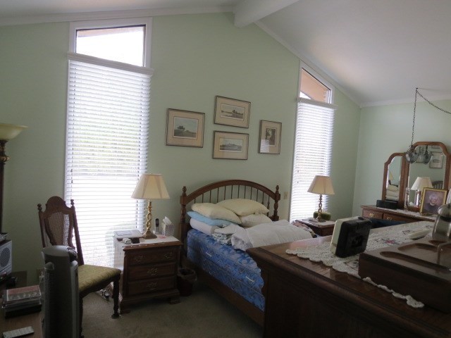 6974 Columbus Road Lizella, GA 31052 - Photo 9 of 19 a bedroom with bed and a window