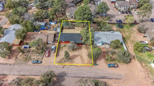 an aerial view of a house with outdoor space