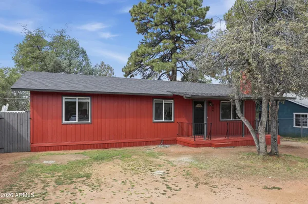 a house with trees in the background