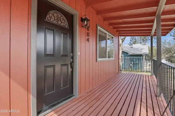 a view of porch with wooden floor