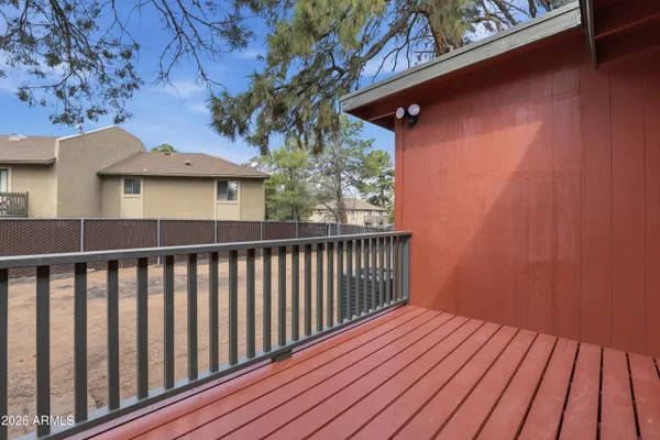 a view of a wooden fence and a porch