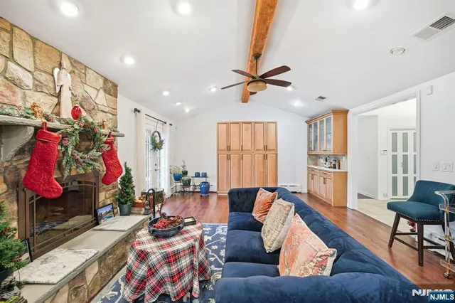a living room with furniture kitchen and a window
