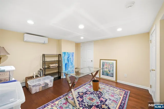 a living room with furniture and a rug