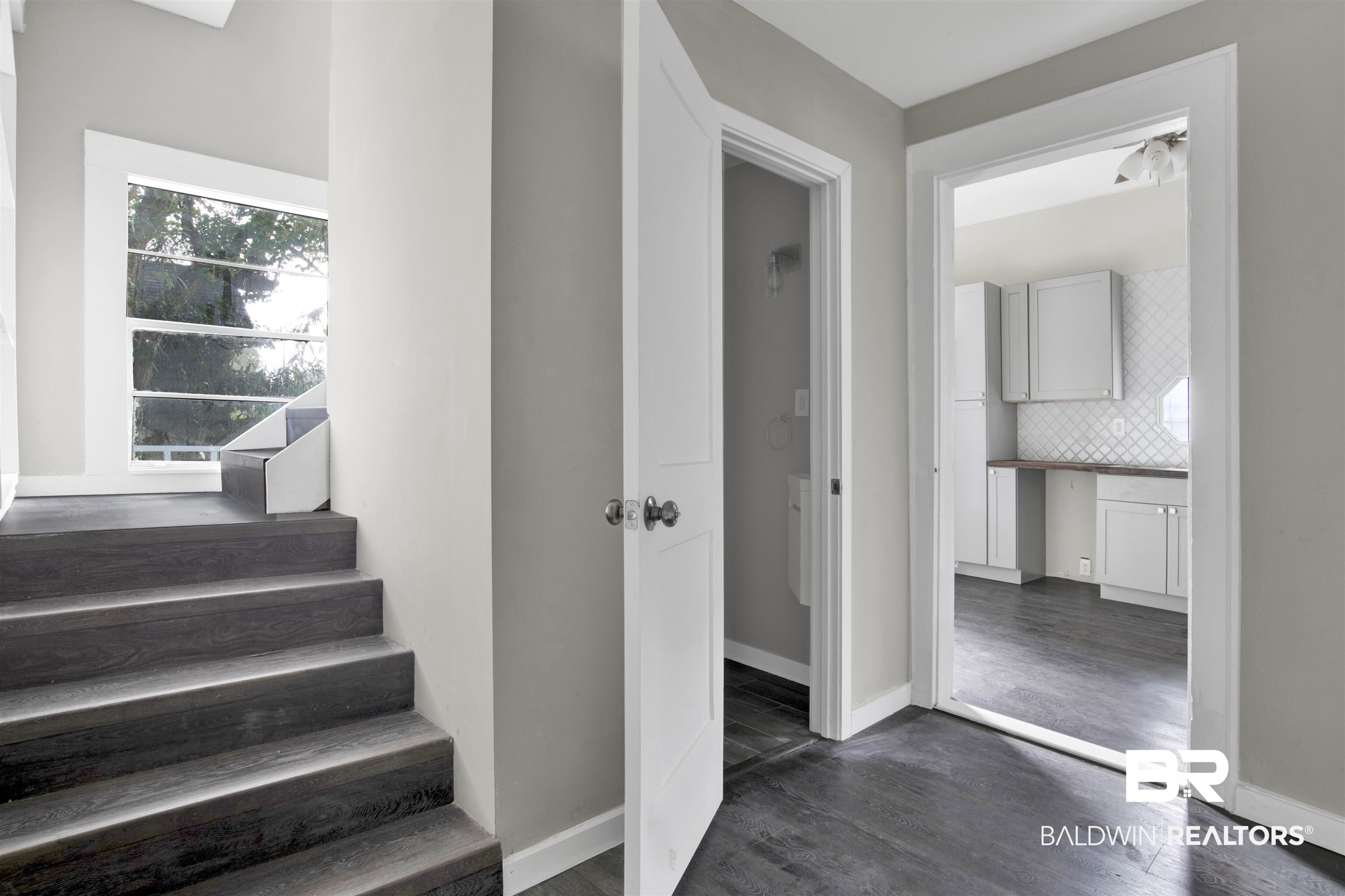 1063 Selma Street Mobile, AL 36604 - Photo 22 of 32 Staircase featuring wood finished floors and baseboards
