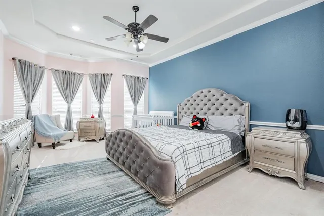 a bedroom with two beds and window