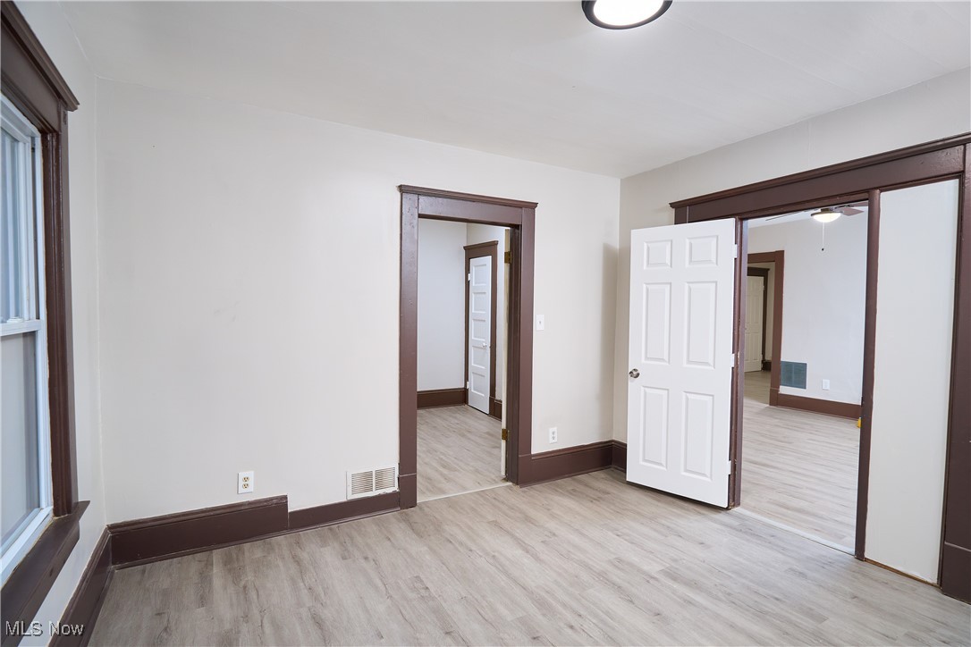 5432 State Road Parma, OH 44134 - Photo 37 of 47 Empty room with light wood finished floors and baseboards