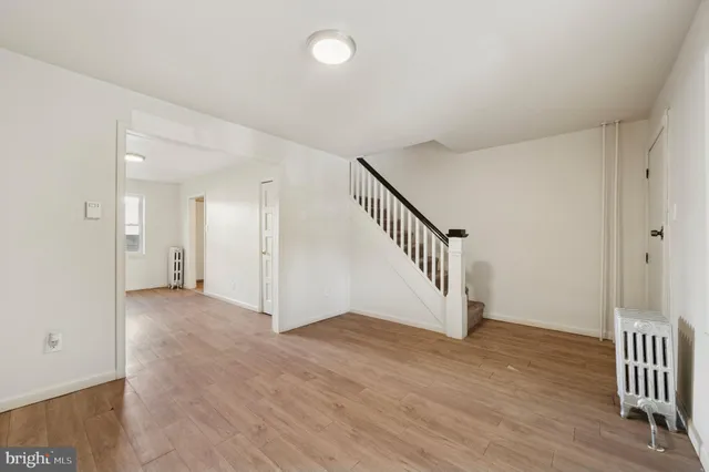 a view of an entryway with wooden floor