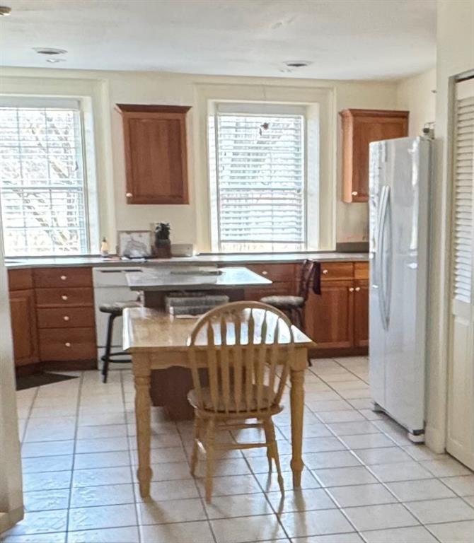 1319 Riverside Drive, Unit 300 Beaver, PA 15009 - Photo 5 of 17 a kitchen with granite countertop a stove a sink and a refrigerator