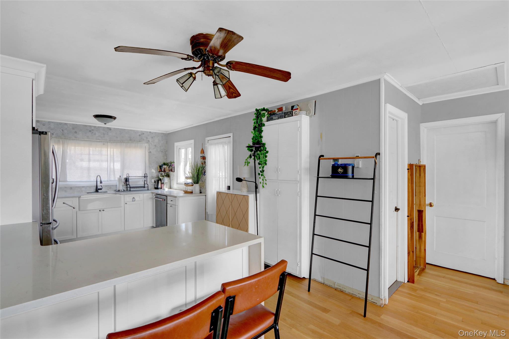 243 Lakeside Trail Ridge, NY 11961 - Photo 13 of 38 a view of kitchen with cabinets and wooden floor
