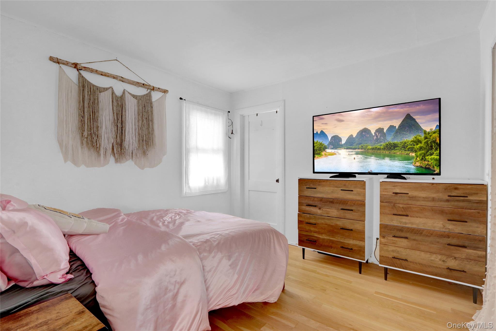 243 Lakeside Trail Ridge, NY 11961 - Photo 15 of 38 a bedroom with a bed and a flat screen tv