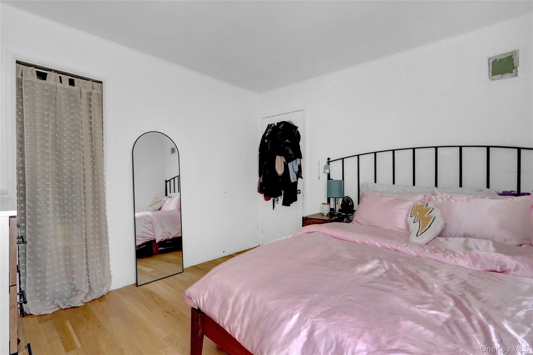 243 Lakeside Trail Ridge, NY 11961 - Photo 16 of 38 a bed room with a bed and a mirror