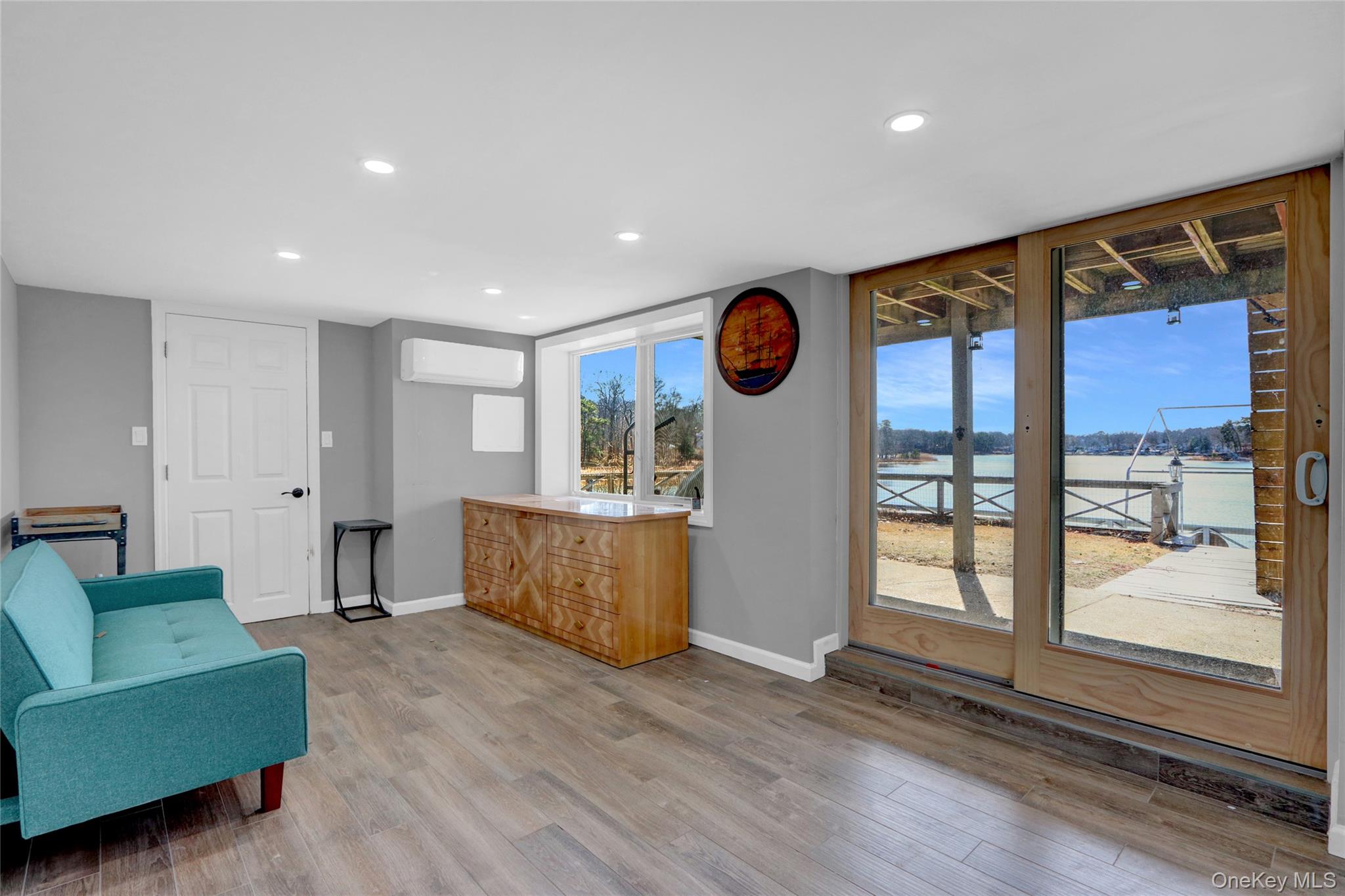 243 Lakeside Trail Ridge, NY 11961 - Photo 18 of 38 a living room with furniture and a large window