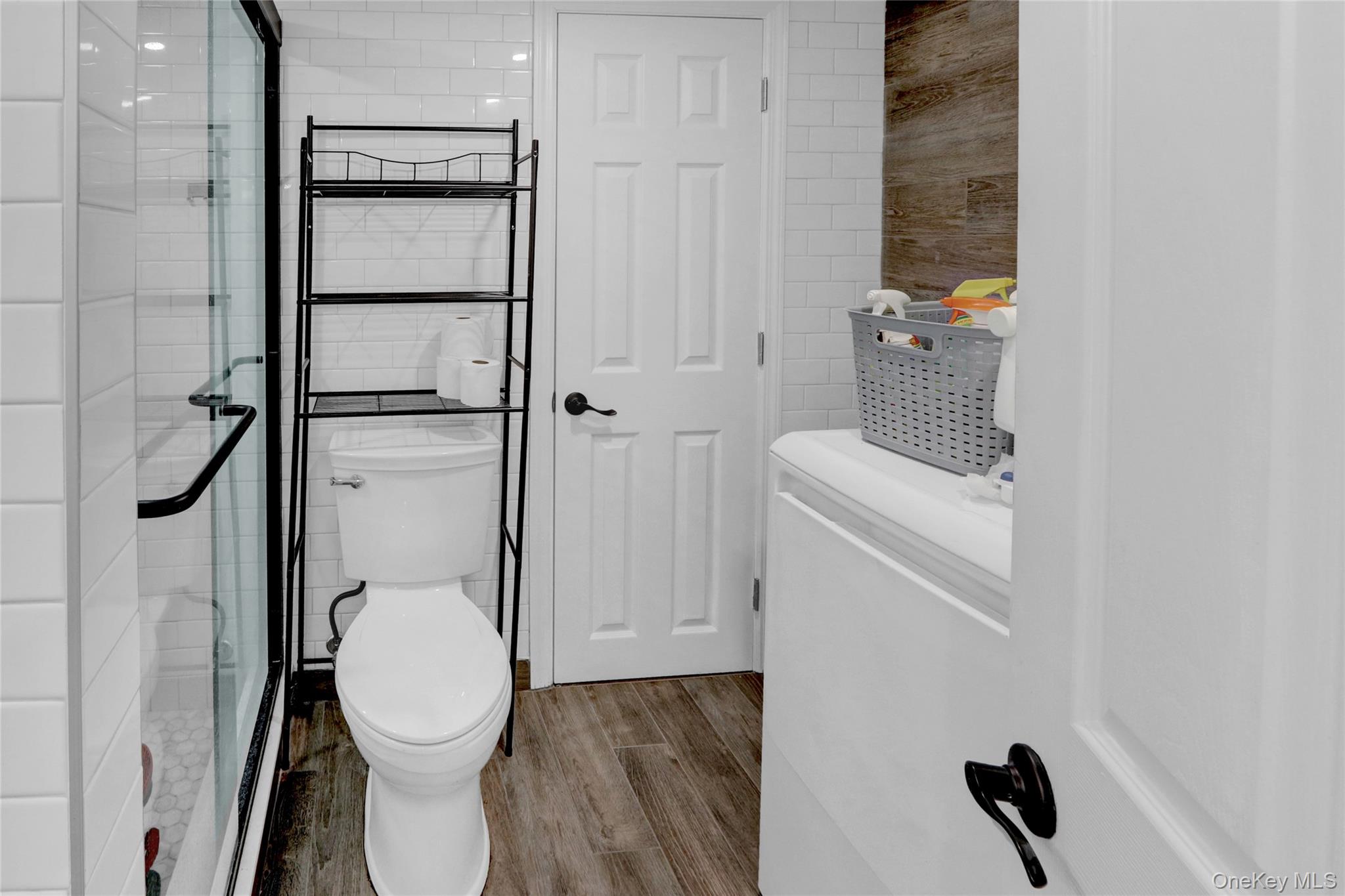 243 Lakeside Trail Ridge, NY 11961 - Photo 21 of 38 a bathroom with a toilet and a shower