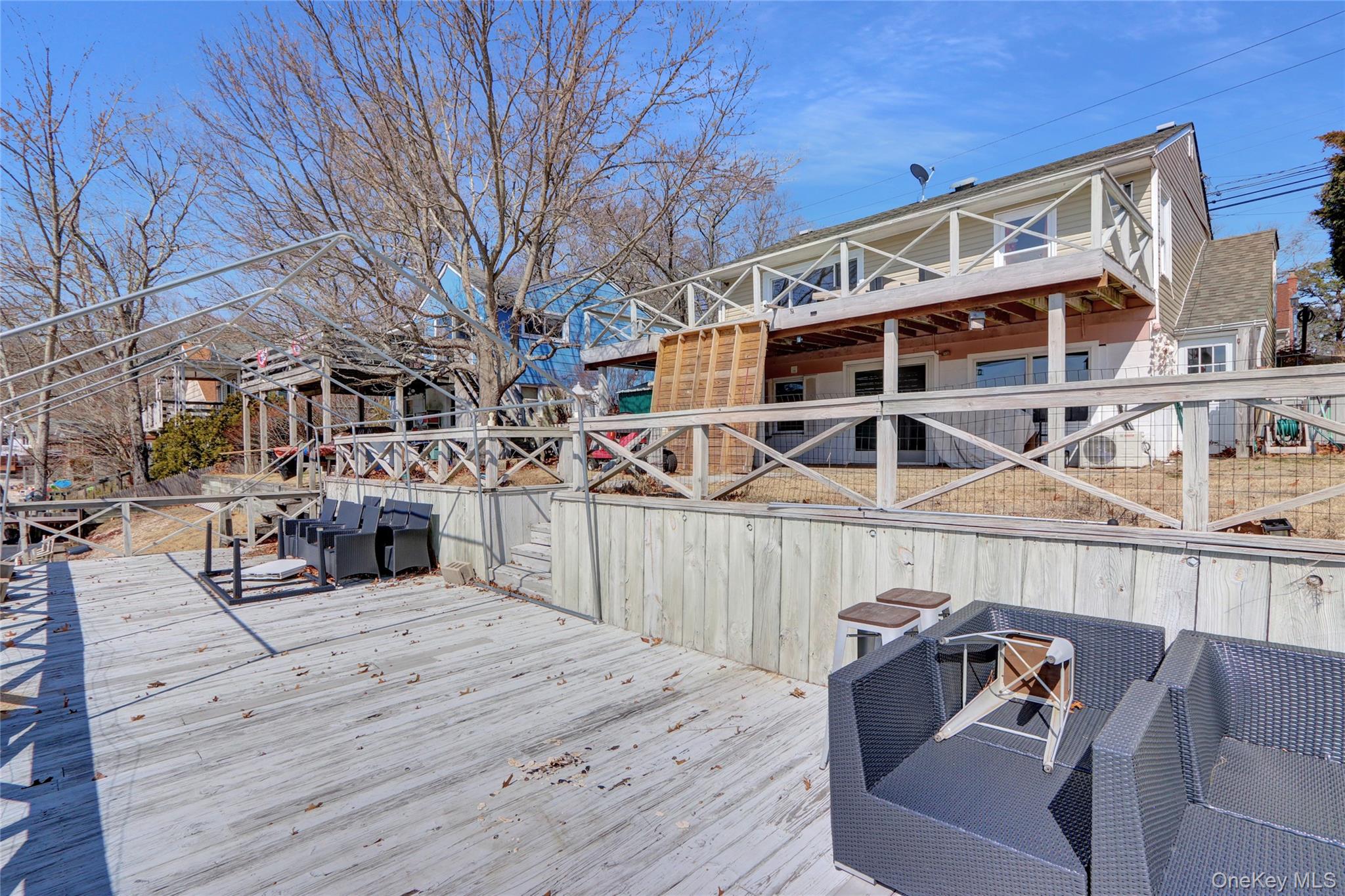 243 Lakeside Trail Ridge, NY 11961 - Photo 25 of 38 a view of a chairs and table on the wooden floor