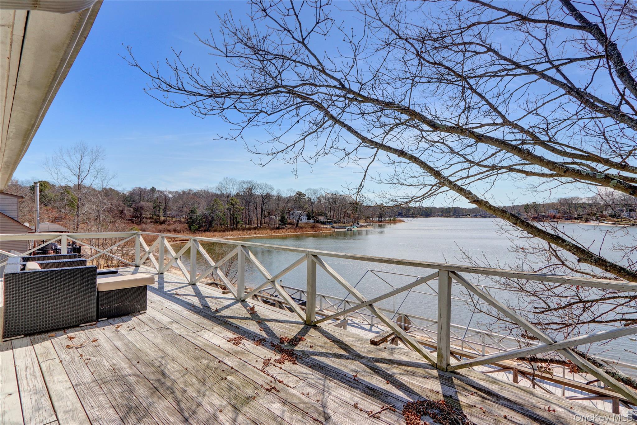 243 Lakeside Trail Ridge, NY 11961 - Photo 27 of 38 a view of house with outdoor seating and city view