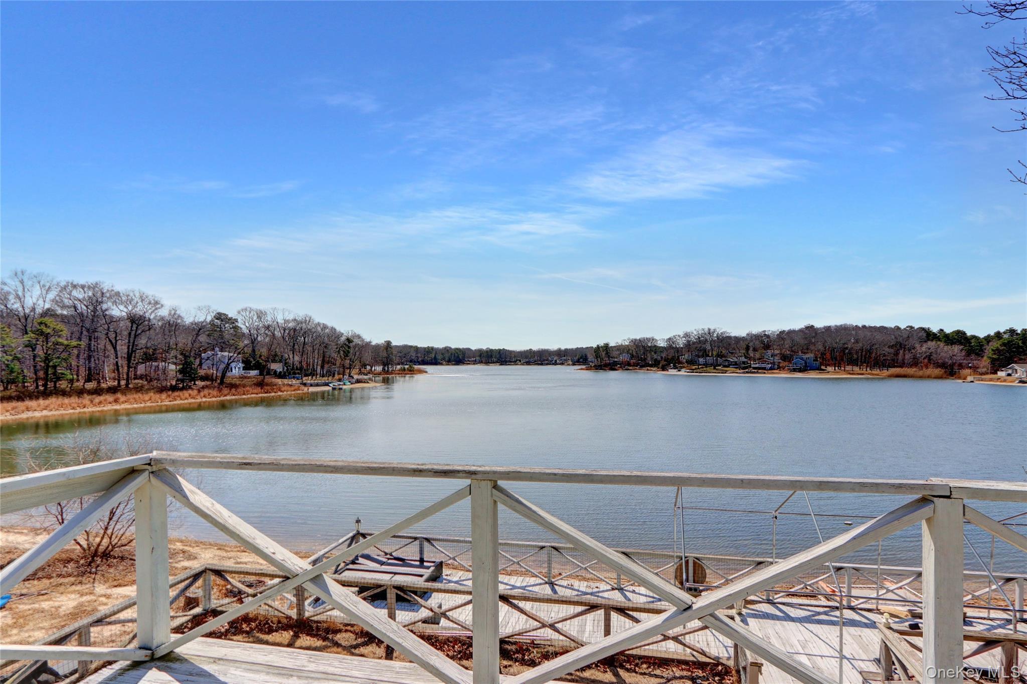 243 Lakeside Trail Ridge, NY 11961 - Photo 29 of 38 a view of a lake from a balcony