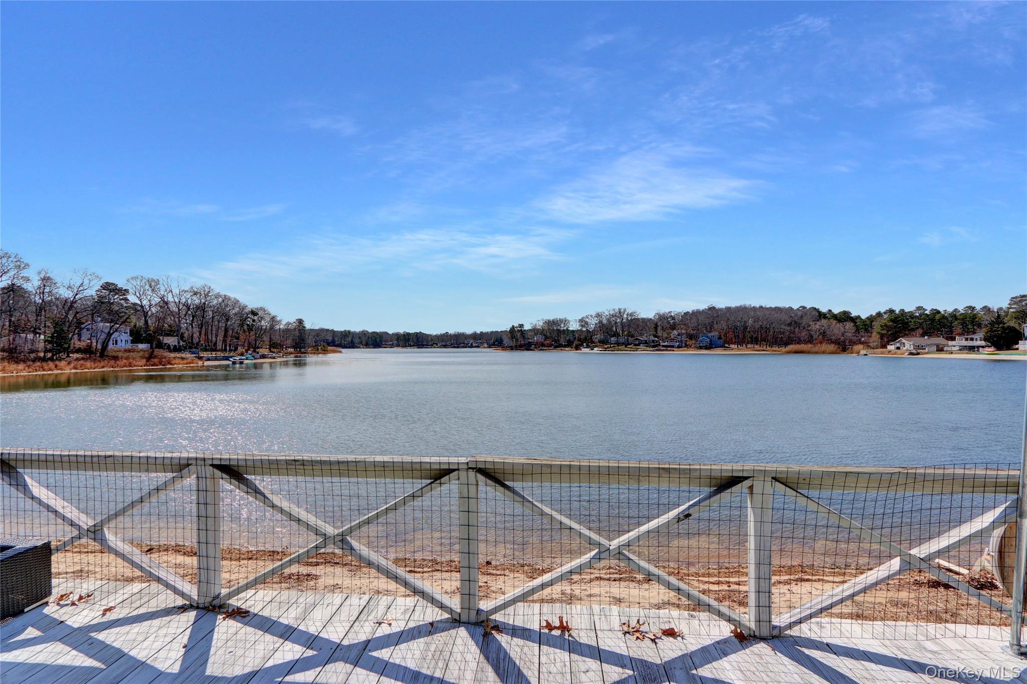 243 Lakeside Trail Ridge, NY 11961 - Photo 31 of 38 a view of a lake with a outdoor space