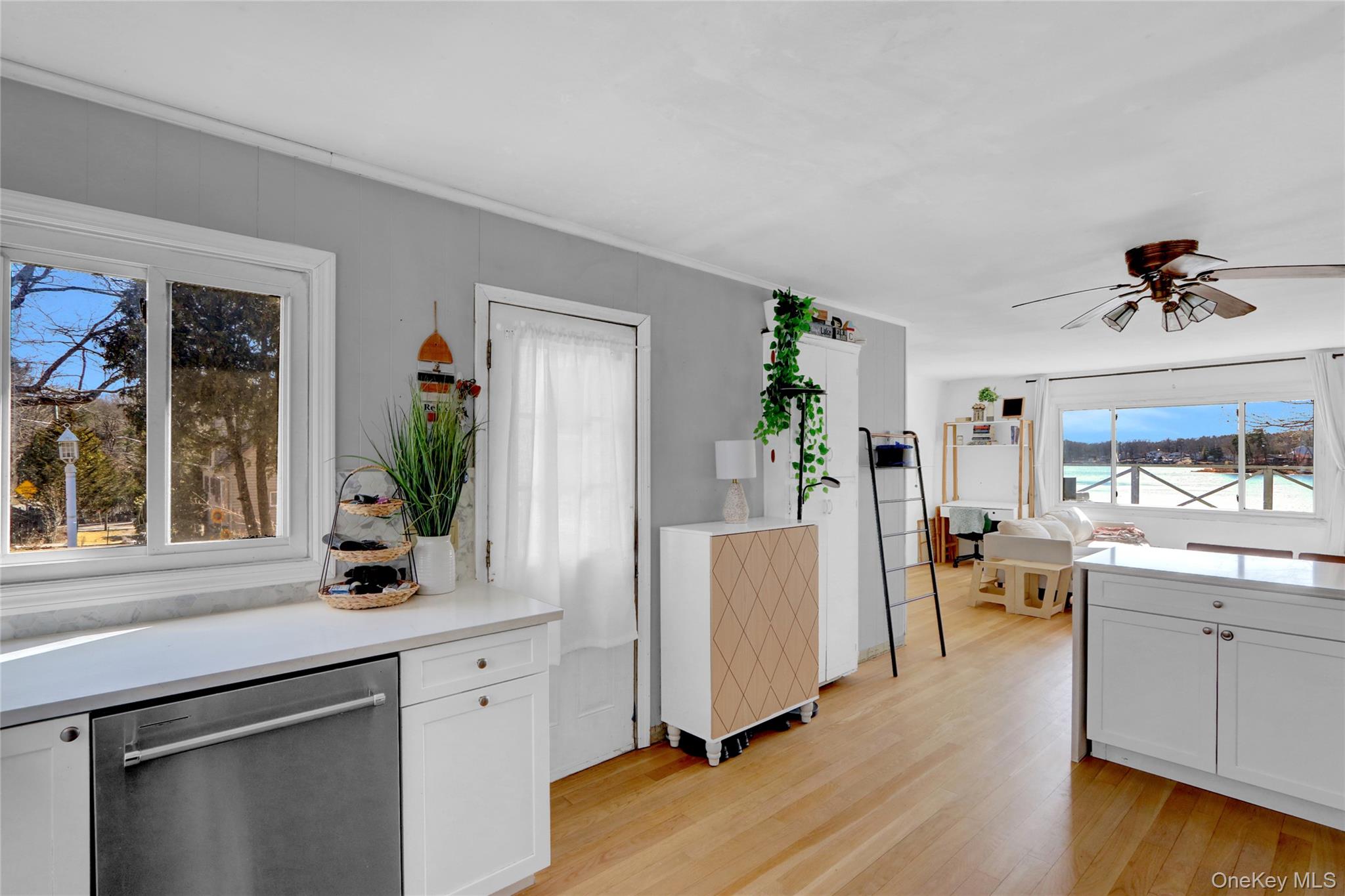 243 Lakeside Trail Ridge, NY 11961 - Photo 5 of 38 a living room with furniture and a large window