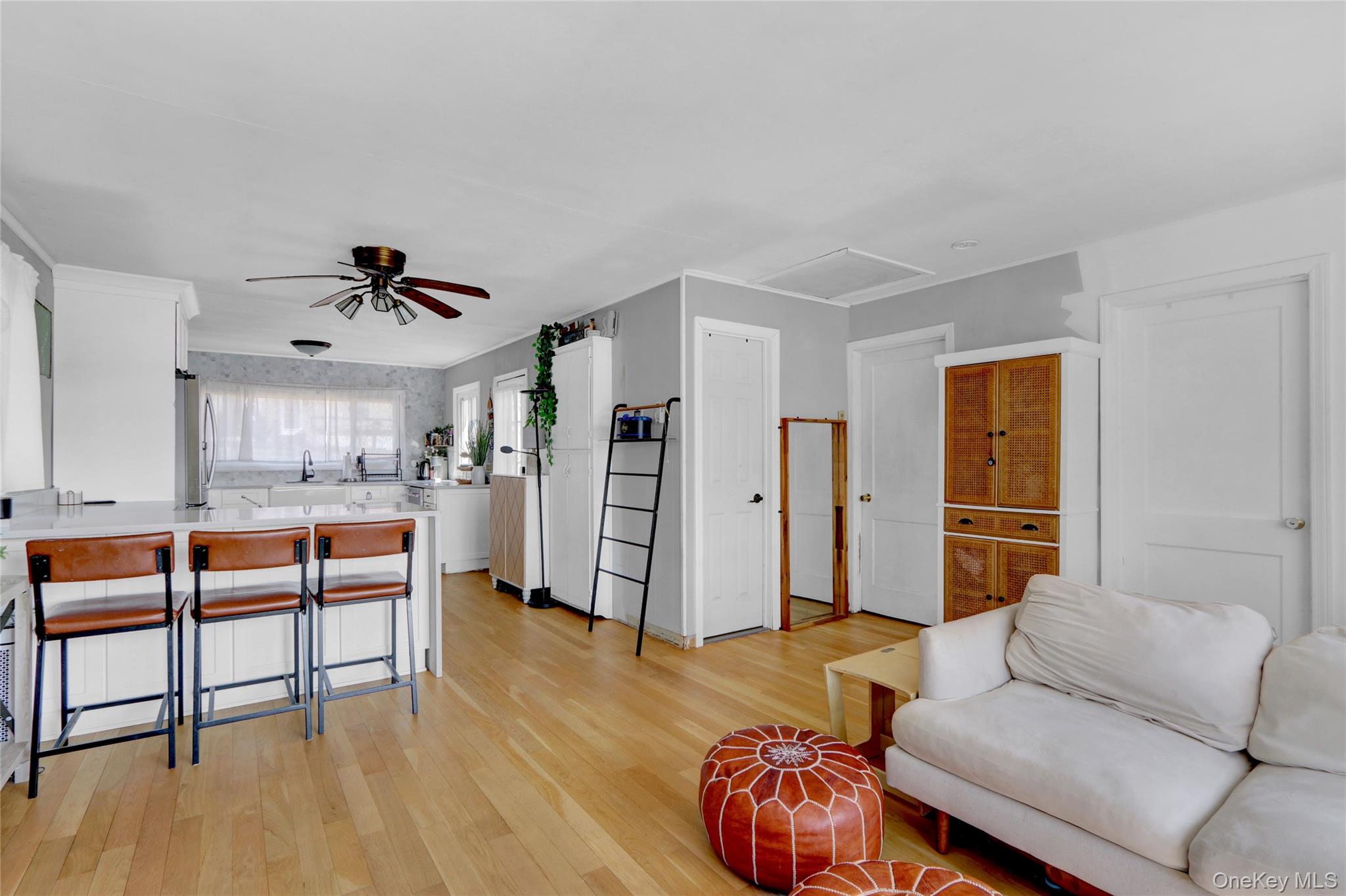 243 Lakeside Trail Ridge, NY 11961 - Photo 9 of 38 a living room with furniture and a wooden floor