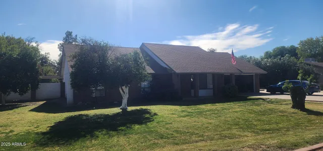 a house view with a backyard space