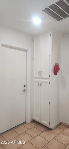 a large kitchen with stainless steel appliances granite countertop a stove a sink and a microwave